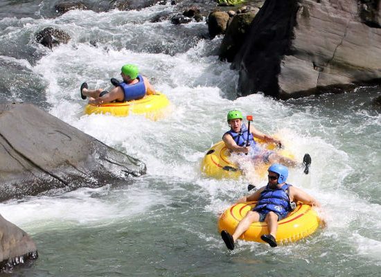 Antours Dominica Guests enjoying River Tubing on Layou river